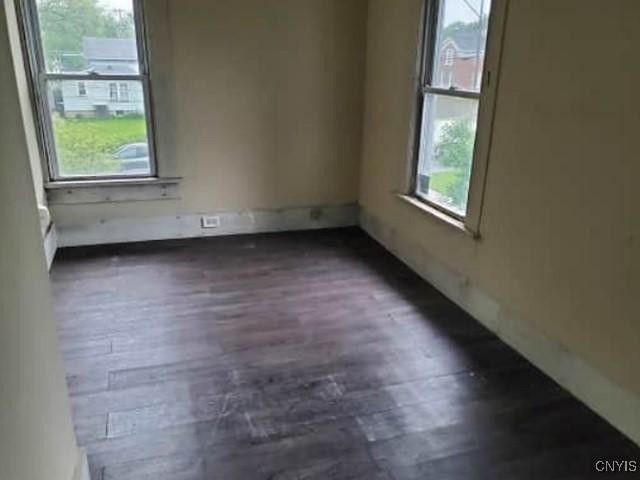 211 Vienna St, Arcadia, NY 14513 - empty room with dark wood-style floors