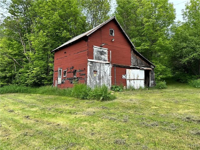 21 Church St, Fine, NY 13617 - view of barn with a yard