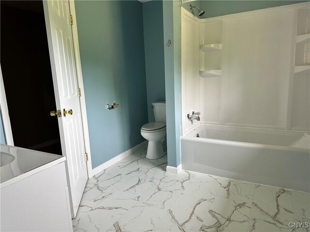 21 Church St, Fine, NY 13617 - bathroom featuring marble finish floors, toilet, shower / washtub combination, baseboards, and vanity