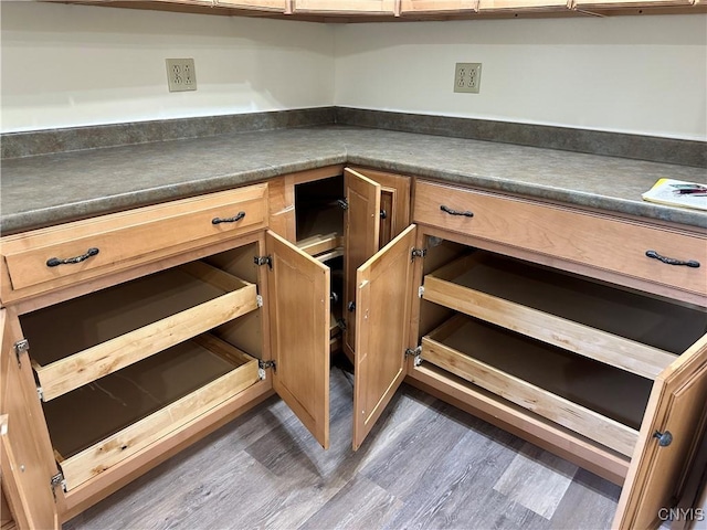 21 Church St, Fine, NY 13617 - kitchen featuring wood finished floors, dark countertops, and brown cabinetry