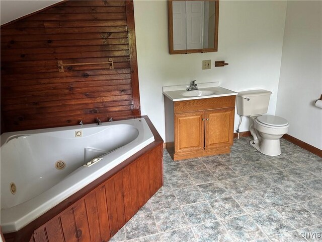 21 Church St, Fine, NY 13617 - full bathroom featuring vanity, a jetted tub, toilet, and baseboards