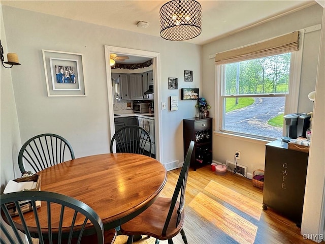 5812 S Street Rd, Fleming, NY 13021 - dining room with light wood-style flooring and baseboards