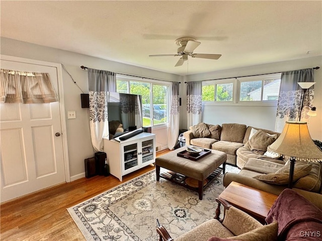 5812 S Street Rd, Fleming, NY 13021 - living room with a ceiling fan, wood finished floors, and baseboards