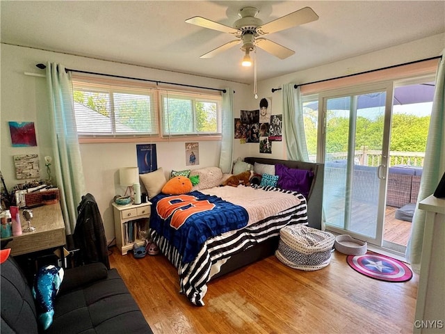 5812 S Street Rd, Fleming, NY 13021 - bedroom with access to outside, wood finished floors, and ceiling fan