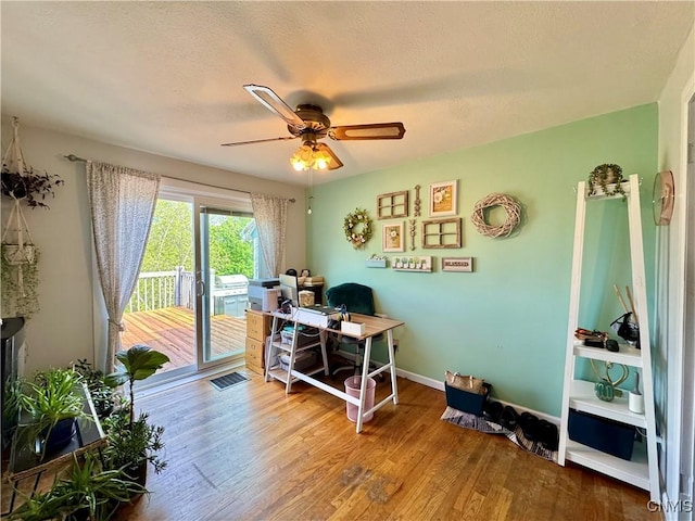 5812 S Street Rd, Fleming, NY 13021 - office featuring ceiling fan, wood finished floors, baseboards, and a textured ceiling