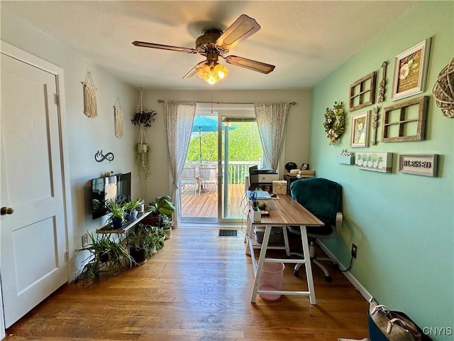 5812 S Street Rd, Fleming, NY 13021 - home office featuring wood finished floors, ceiling fan, a textured ceiling, and baseboards