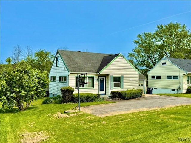 5812 S Street Rd, Fleming, NY 13021 - view of front of property featuring driveway, a front yard, a garage, and roof with shingles