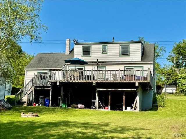 5812 S Street Rd, Fleming, NY 13021 - back of property with a deck, a lawn, a chimney, and stairway