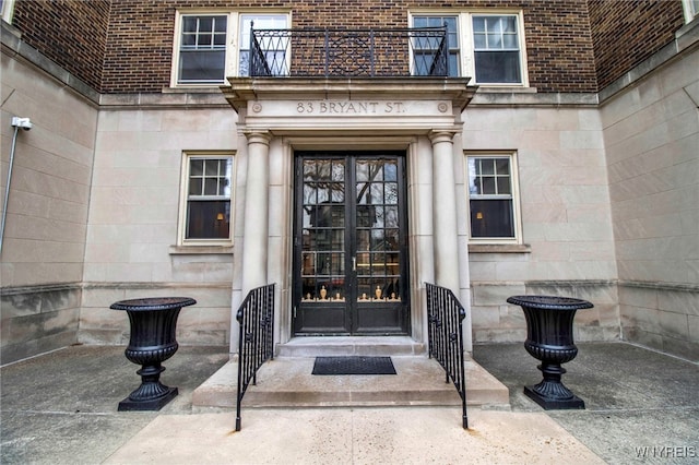83 Bryant St Unit 7D, Buffalo, NY 14209 - property entrance with french doors, brick siding, and stone siding