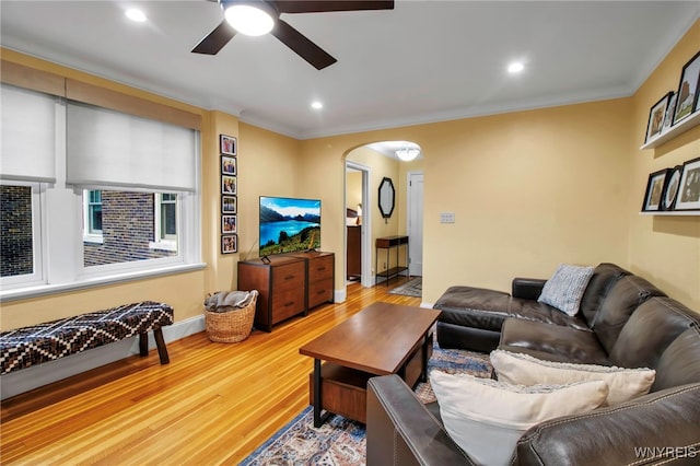 83 Bryant St Unit 7D, Buffalo, NY 14209 - living room with a ceiling fan, wood finished floors, arched walkways, crown molding, and recessed lighting