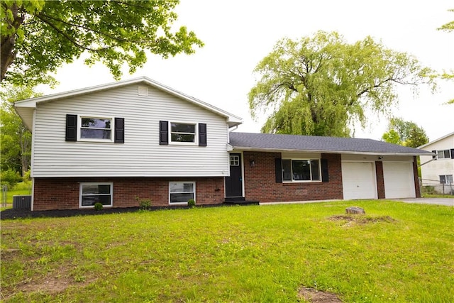 136 Nevins Rd, Henrietta, NY 14467 - tri-level home featuring an attached garage, a front yard, cooling unit, driveway, and brick siding