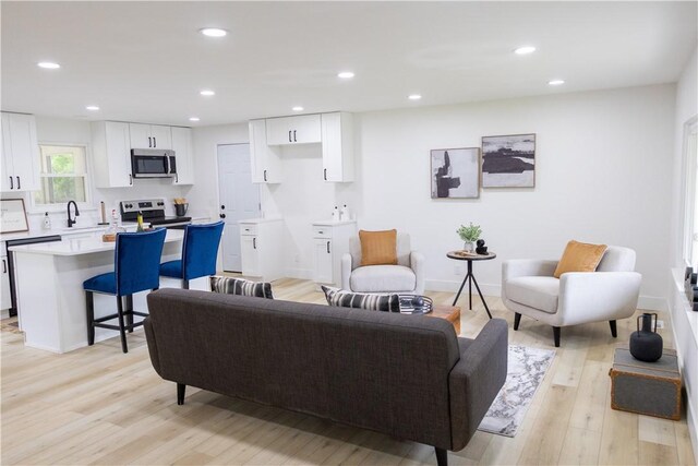 136 Nevins Rd, Henrietta, NY 14467 - living area featuring light wood-style floors and recessed lighting