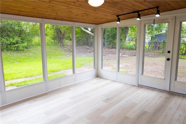 136 Nevins Rd, Henrietta, NY 14467 - unfurnished sunroom with rail lighting, plenty of natural light, wood ceiling, and wood finished floors