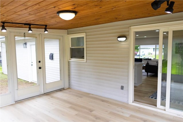 136 Nevins Rd, Henrietta, NY 14467 - unfurnished sunroom featuring track lighting