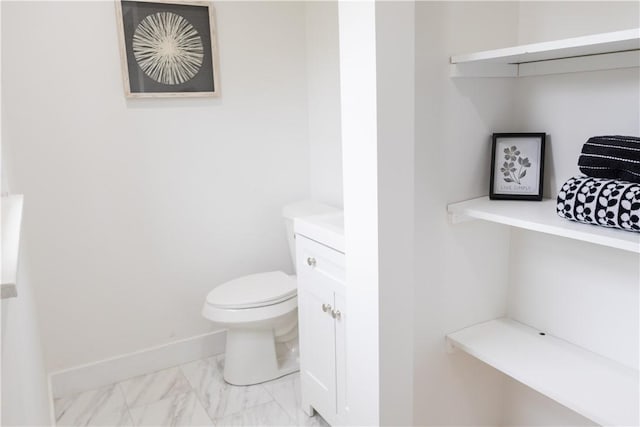 136 Nevins Rd, Henrietta, NY 14467 - half bath with toilet, baseboards, vanity, and marble finish floors