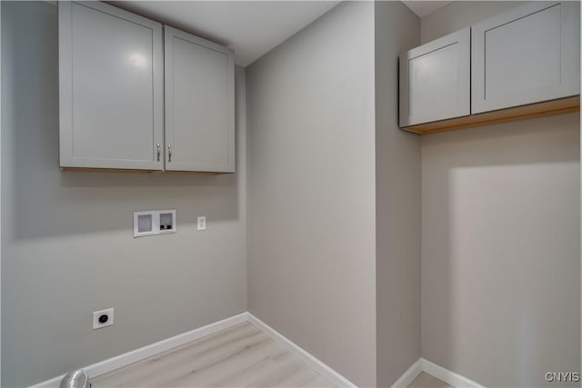 34292 State Route 26, Champion, NY 13619 - laundry area featuring electric dryer hookup, washer hookup, cabinet space, light wood-style flooring, and baseboards
