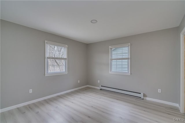 34292 State Route 26, Champion, NY 13619 - spare room with a baseboard heating unit, light wood-style flooring, and baseboards