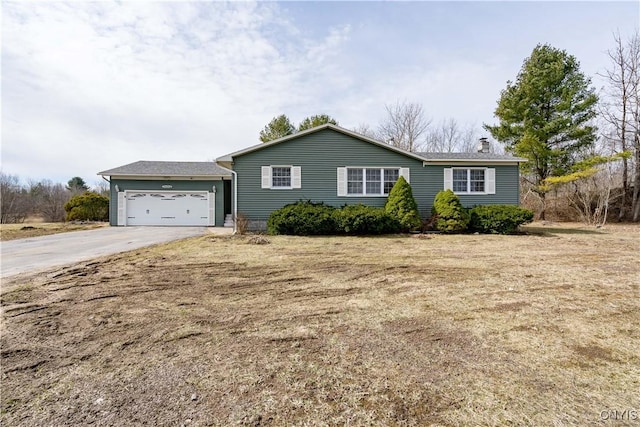 34292 State Route 26, Champion, NY 13619 - ranch-style house featuring driveway, a chimney, and an attached garage
