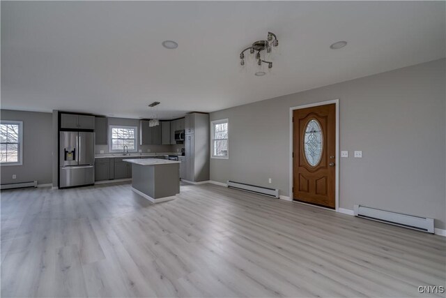 34292 State Route 26, Champion, NY 13619 - kitchen featuring stainless steel appliances, a baseboard heating unit, and light countertops