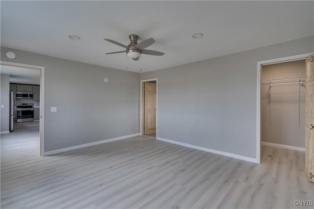 34292 State Route 26, Champion, NY 13619 - unfurnished bedroom with light wood-style flooring, baseboards, a spacious closet, and a closet