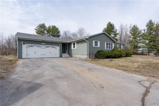 34292 State Route 26, Champion, NY 13619 - single story home featuring asphalt driveway and a garage