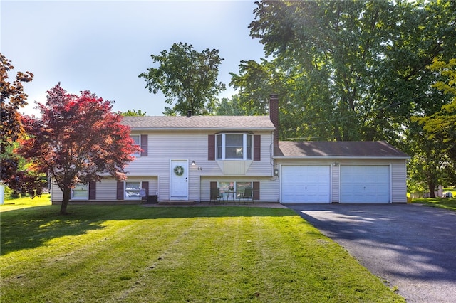 44 Hidden Creek Ln, Hamlin, NY 14464 - bi-level home with a garage, driveway, a front yard, and a chimney