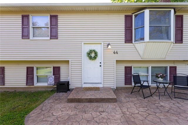 44 Hidden Creek Ln, Hamlin, NY 14464 - doorway to property featuring a patio area