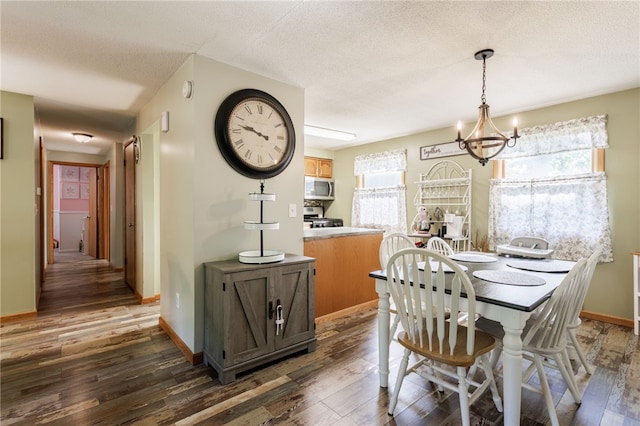 44 Hidden Creek Ln, Hamlin, NY 14464 - dining room featuring dark wood-style floors, a chandelier, baseboards, and a textured ceiling