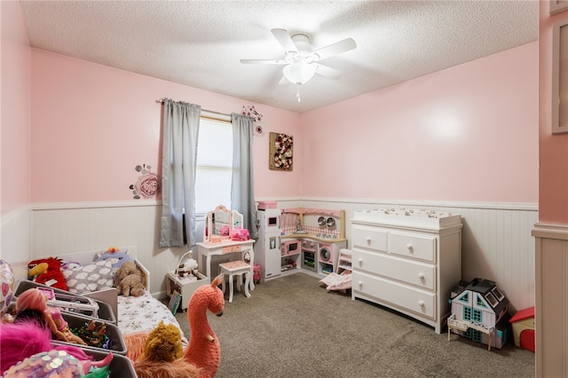 44 Hidden Creek Ln, Hamlin, NY 14464 - recreation room featuring wainscoting, ceiling fan, carpet floors, and a textured ceiling
