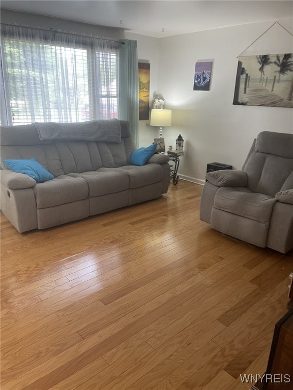 1003 98th St, Niagara Falls, NY 14304 - living area with light wood-style floors and baseboards