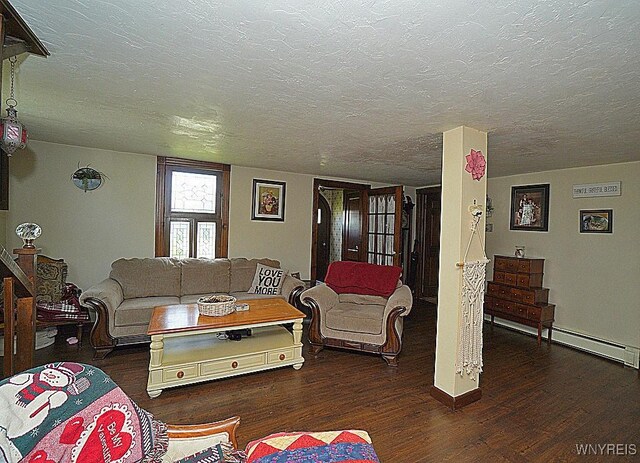 2477 Ridge Rd, Lewiston, NY 14131 - living room with wood finished floors, a baseboard radiator, a textured ceiling, and baseboards