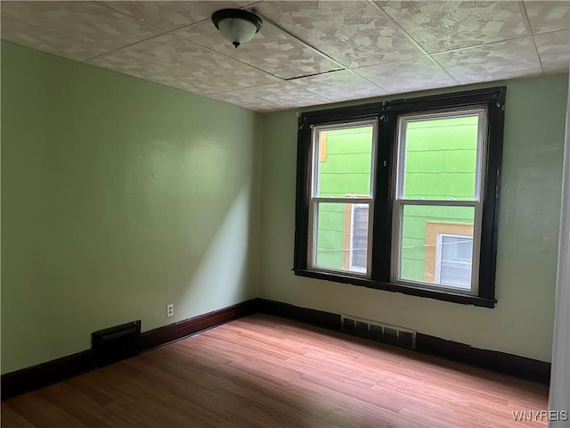 64 Barton St, Buffalo, NY 14213 - spare room with wood finished floors and baseboards