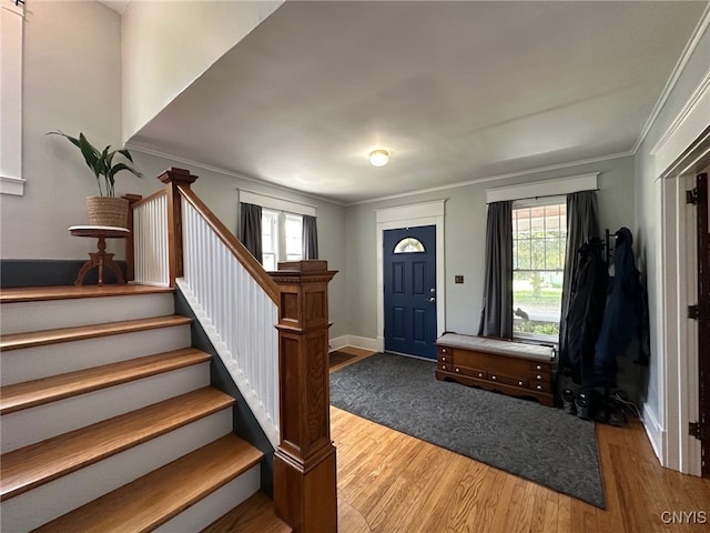 616 N Main St, Herkimer, NY 13350 - entrance foyer featuring wood finished floors, stairway, ornamental molding, and baseboards