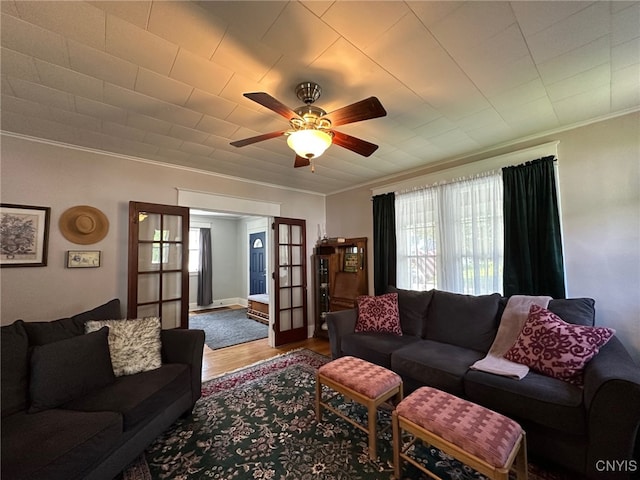 616 N Main St, Herkimer, NY 13350 - living room featuring ornamental molding, a ceiling fan, and wood finished floors