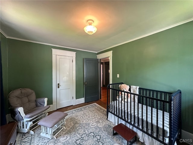 616 N Main St, Herkimer, NY 13350 - bedroom featuring ornamental molding, wood finished floors, and baseboards