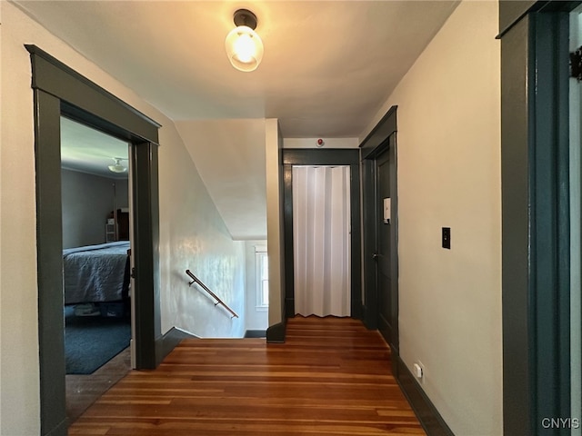 616 N Main St, Herkimer, NY 13350 - hallway with an upstairs landing, wood finished floors, and baseboards