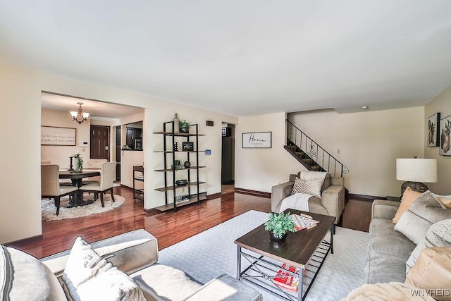 305 Vine Ln, Amherst, NY 14228 - living area with wood finished floors, a chandelier, stairs, and baseboards