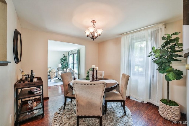 305 Vine Ln, Amherst, NY 14228 - dining room with dark wood-style floors and a chandelier