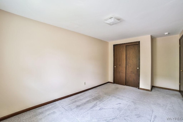 305 Vine Ln, Amherst, NY 14228 - unfurnished bedroom with light carpet, baseboards, and a closet