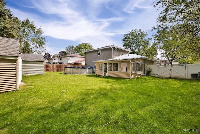 305 Vine Ln, Amherst, NY 14228 - back of house with a gate and a covered pool