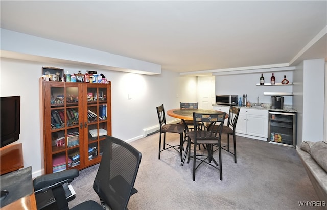 283 Summit Ave, West Seneca, NY 14224 - dining area with wine cooler, bar with sink, carpet flooring, and baseboards