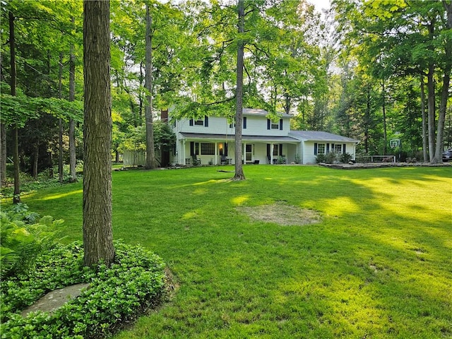 52 Woodland Dr, Big Flats, NY 14814 - view of front of home with a front lawn and a porch