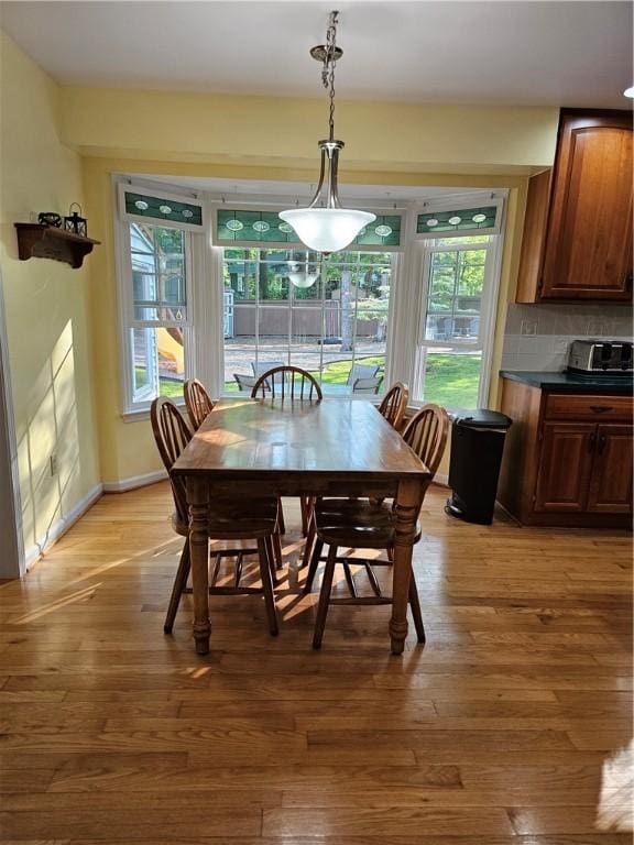 52 Woodland Dr, Big Flats, NY 14814 - dining space featuring light wood-type flooring and baseboards