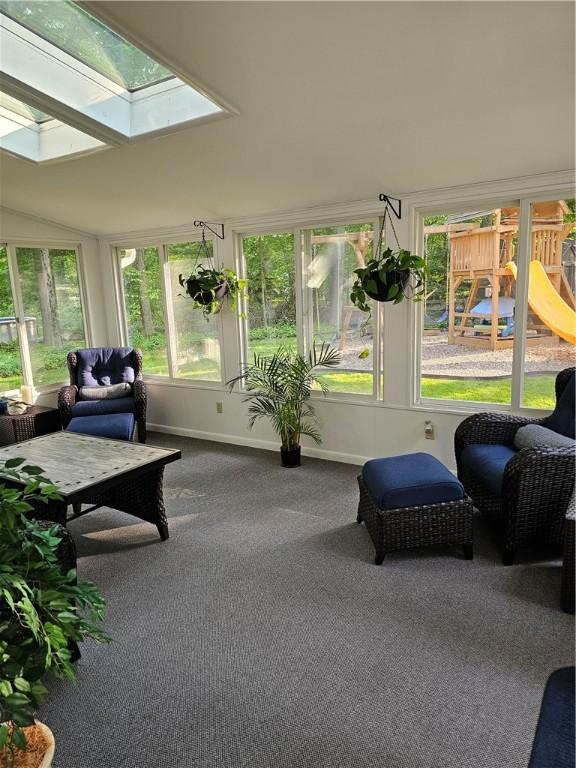 52 Woodland Dr, Big Flats, NY 14814 - sunroom featuring a skylight, carpet, and baseboards