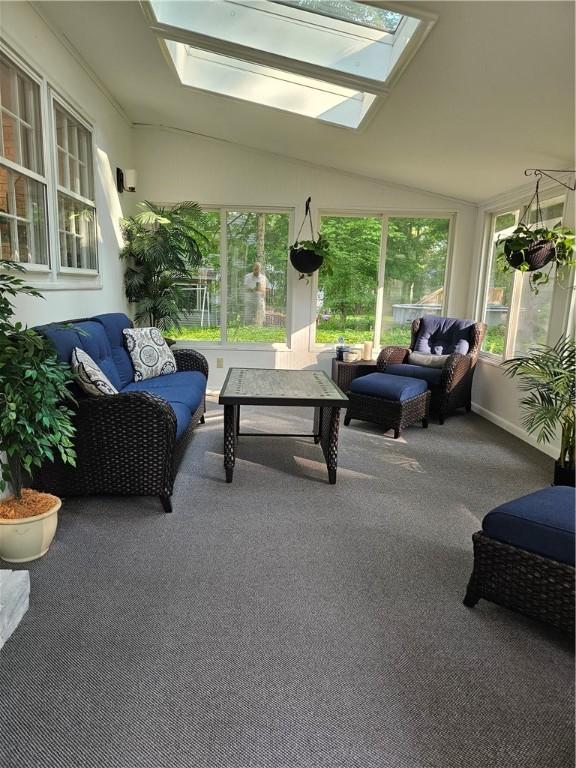 52 Woodland Dr, Big Flats, NY 14814 - sunroom with a skylight, an outdoor hangout area, vaulted ceiling, and carpet flooring