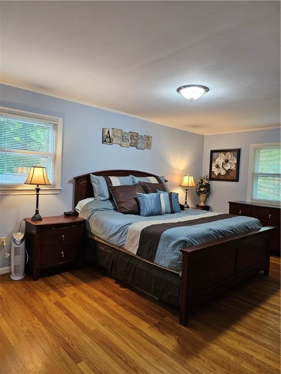52 Woodland Dr, Big Flats, NY 14814 - bedroom featuring wood finished floors and ornamental molding