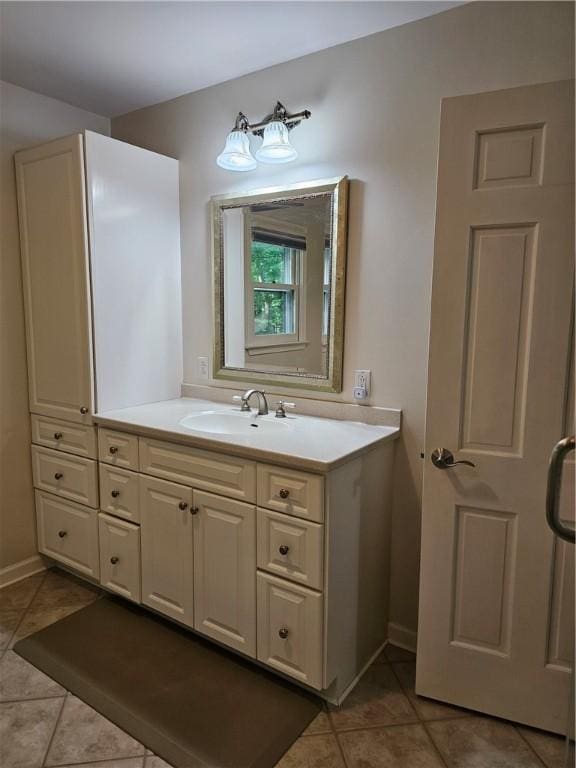52 Woodland Dr, Big Flats, NY 14814 - bathroom with tile patterned floors, vanity, and baseboards