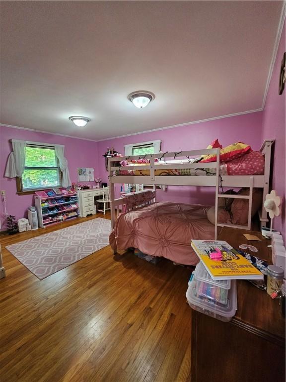 52 Woodland Dr, Big Flats, NY 14814 - bedroom featuring wood finished floors and ornamental molding