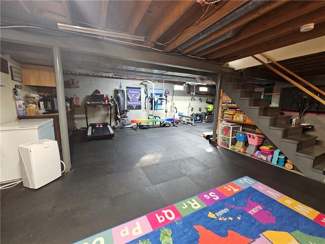 52 Woodland Dr, Big Flats, NY 14814 - unfinished below grade area with rubber floors and stairway