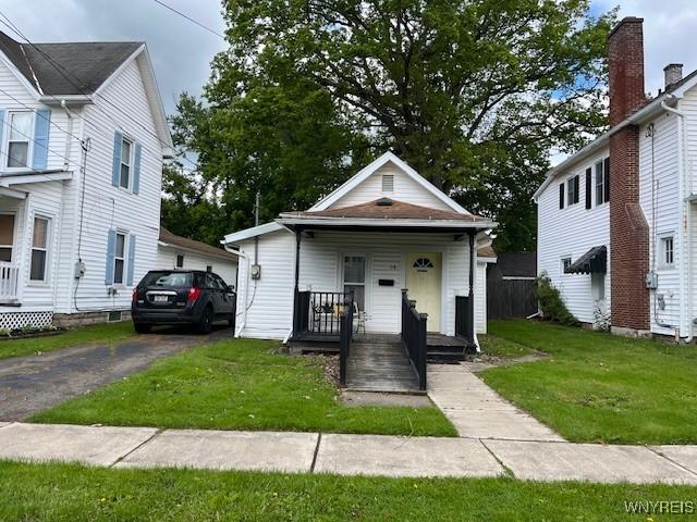 114 S 10th St, Olean-City, NY 14760 - view of front facade featuring a porch and a front lawn